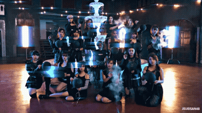 A Group Of Women Are Posing In Front Of A Fountain And A Sign That Says " Jeleisen48 " GIF