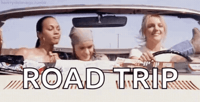 A Group Of Women Are Sitting In A Car With The Words `` Road Trip '' Written On The Side . GIF