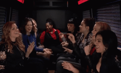 A Group Of Women Are Sitting In A Limo Laughing And Clapping GIF