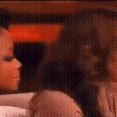 A Group Of Women Are Sitting Next To Each Other And Talking . GIF