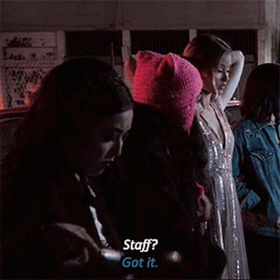 A Group Of Women Are Standing In A Dark Room And One Of Them Says " Staff ? Got It " GIF