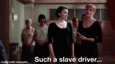 A Group Of Women Are Standing In A Room Talking To Each Other . GIF