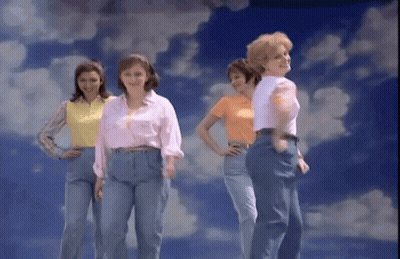 A Group Of Women Are Standing In Front Of A Cloudy Sky GIF
