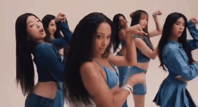 A Group Of Women Are Standing Next To Each Other And Dancing In Front Of A White Background . GIF