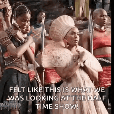 A Group Of Women Are Standing Next To Each Other In A Line Holding Spears And A Fan . GIF