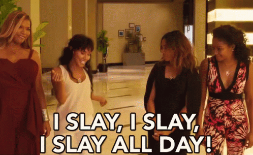 A Group Of Women Are Walking Down A Hallway And One Of Them Is Saying I Slay I Slay GIF