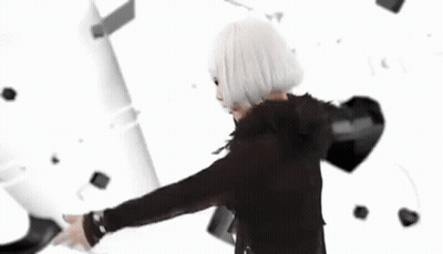 A Group Of Women In Black And White Dresses Are Walking In A Row GIF