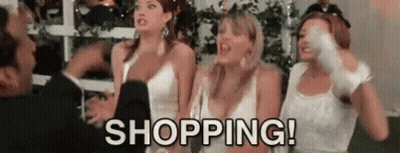 A Group Of Women In White Dresses Are Standing Next To Each Other And A Man Is Standing Behind Them . GIF