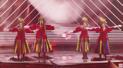 A Group Of Women Singing On A Stage With A Youtube Logo In The Lower Right Corner GIF