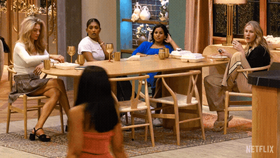 A Group Of Women Sitting Around A Table With A Netflix Logo On The Corner GIF