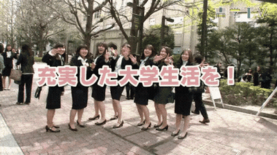 A Group Of Women Standing In Front Of A Sign That Says ' Tv ' GIF