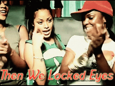 A Group Of Women Standing Next To Each Other With The Words Then We Locked Eyes Above Them GIF