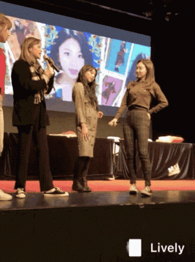A Group Of Women Standing On A Stage With The Word Lively On The Bottom Right GIF