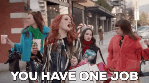 A Group Of Women Walking Down A Street With The Words " You Have One Job " Written On The Bottom GIF