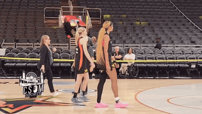 A Group Of Women Walking On A Basketball Court With Cs3m Sports Written On The Bottom GIF