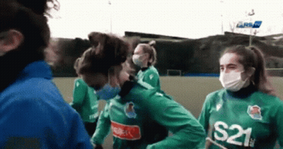 A Group Of Women Wearing Face Masks And S21 Jerseys GIF