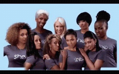 A Group Of Women Wearing T-Shirts That Say She Are Posing For A Picture Together . GIF