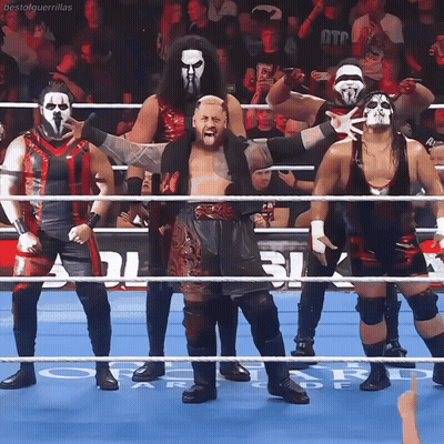 A Group Of Wrestlers Are Standing In A Ring With The Word Bestal Guerrillas On The Bottom Right GIF