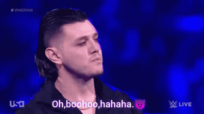A Group Of Wrestlers Are Standing In A Wrestling Ring And One Of Them Says Oh Boohoo Haha GIF