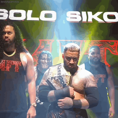 A Group Of Wrestlers Are Standing In Front Of A Banner That Says Solo Siko GIF