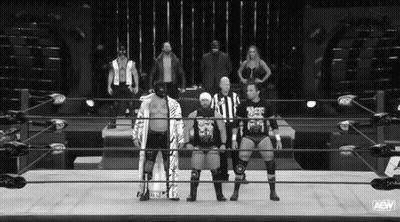 A Group Of Wrestlers Standing In A Ring With Aaw Written On The Bottom GIF