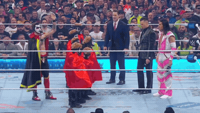 A Group Of Wrestlers Standing In A Ring With The Word Dream On The Bottom Right GIF