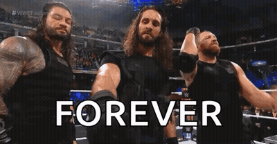 A Group Of Wrestlers Standing Next To Each Other In A Ring With The Words `` Forever '' . GIF