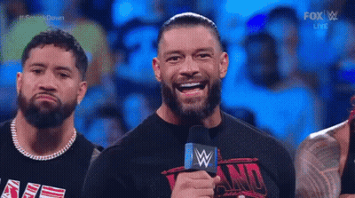 A Group Of Wrestlers Wearing Shirts That Say We The Ones Stand In A Wrestling Ring GIF