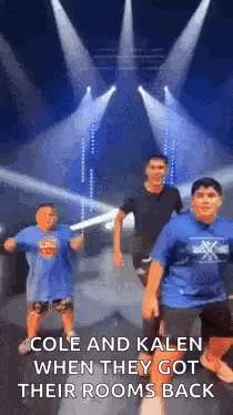 A Group Of Young Boys Are Dancing On A Stage In Front Of A Stage . GIF