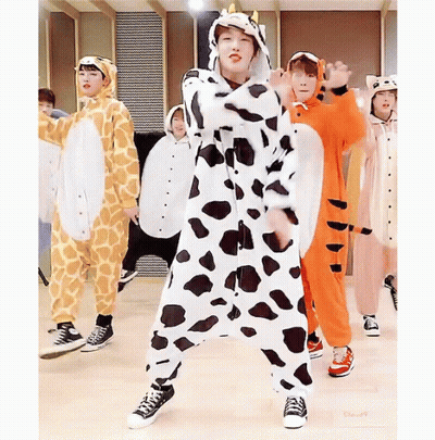 A Group Of Young Boys Are Dressed In Animal Costumes Including A Giraffe And A Tiger GIF