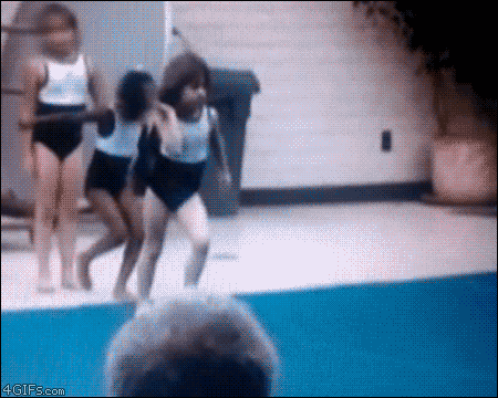 A Group Of Young Girls Are Jumping Into A Swimming Pool And A Man Is Watching Them GIF
