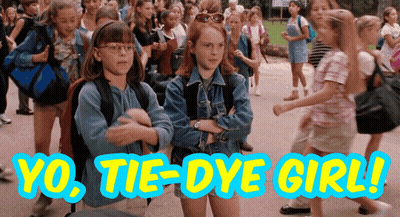 A Group Of Young Girls Are Walking Down A Street With The Words Yo Tie-Dye Girl Written On The Bottom GIF