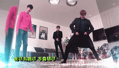 A Group Of Young Men Are Dancing In A Living Room With Chinese Writing On The Wall . GIF