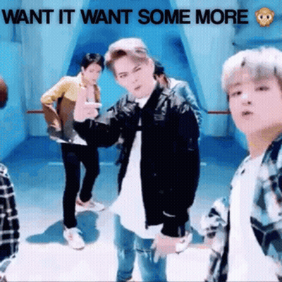 A Group Of Young Men Are Dancing In A Room With The Words Want It Want Some More Written Above Them GIF