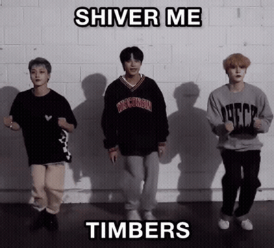 A Group Of Young Men Are Dancing In Front Of A Brick Wall With The Words Shiver Me Timbers Above Them GIF
