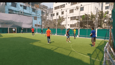 A Group Of Young Men Are Playing Soccer On A Field GIF