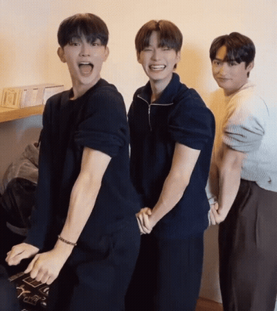 A Group Of Young Men Are Posing For A Picture And One Of Them Has A Bracelet On His Wrist GIF