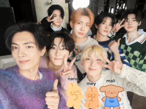 A Group Of Young Men Are Posing For A Picture And One Of Them Has The Name Nana On His Shirt GIF
