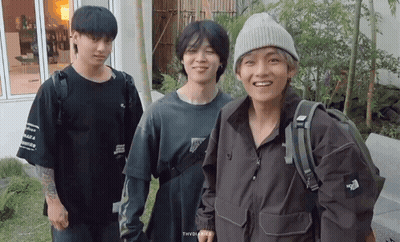 A Group Of Young Men Are Posing For A Picture And One Of Them Is Wearing A North Face Jacket GIF