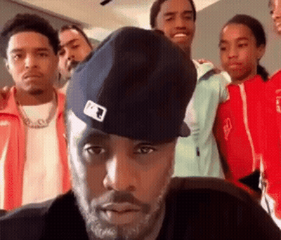 A Group Of Young Men Are Posing For A Picture Together . GIF
