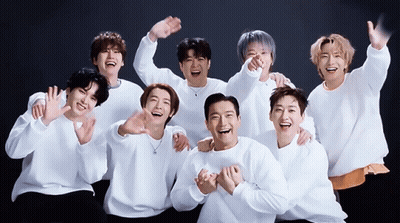 A Group Of Young Men Are Posing For A Picture Together GIF