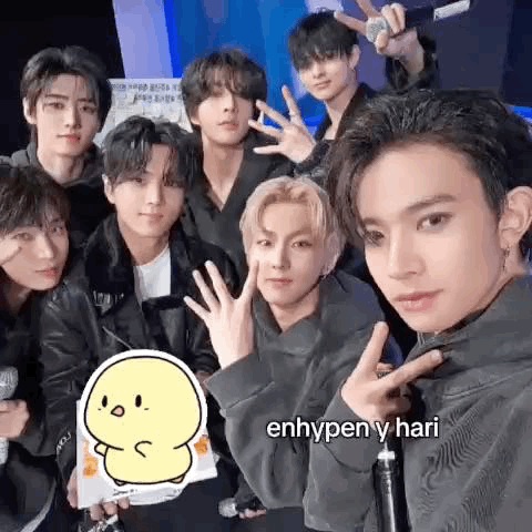 A Group Of Young Men Are Posing For A Picture Together While Holding Microphones . GIF