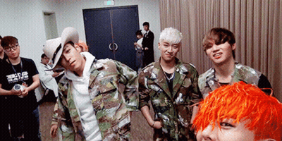 A Group Of Young Men Are Posing For A Picture With One Wearing A Shirt That Says ' Tokyo ' On It GIF
