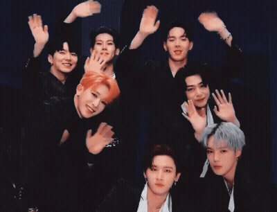 A Group Of Young Men Are Posing For A Picture With Their Hands Up GIF