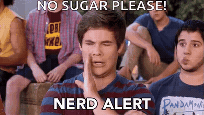 A Group Of Young Men Are Sitting Around A Table And One Of Them Is Wearing A Pandamovie Shirt GIF