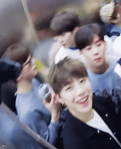 A Group Of Young Men Are Sitting On A Ferris Wheel And Smiling . GIF
