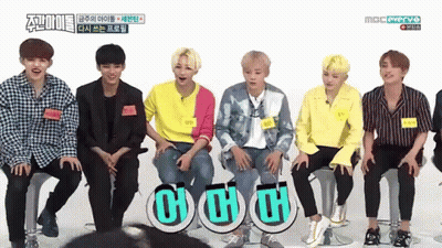 A Group Of Young Men Are Sitting On Stools And One Of Them Is Wearing A Name Tag That Says ' A ' GIF
