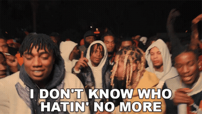 A Group Of Young Men Are Standing In A Crowd With The Words I Don 'T Know Who Hatin ' No More GIF