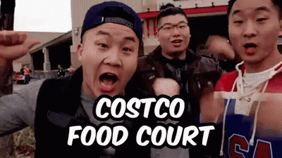 A Group Of Young Men Are Standing In Front Of A Costco Food Court Sign GIF