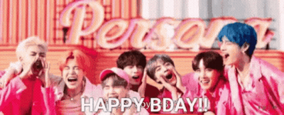 A Group Of Young Men Are Standing Next To Each Other And Laughing In Front Of A Sign That Says `` Happy Bday '' . GIF